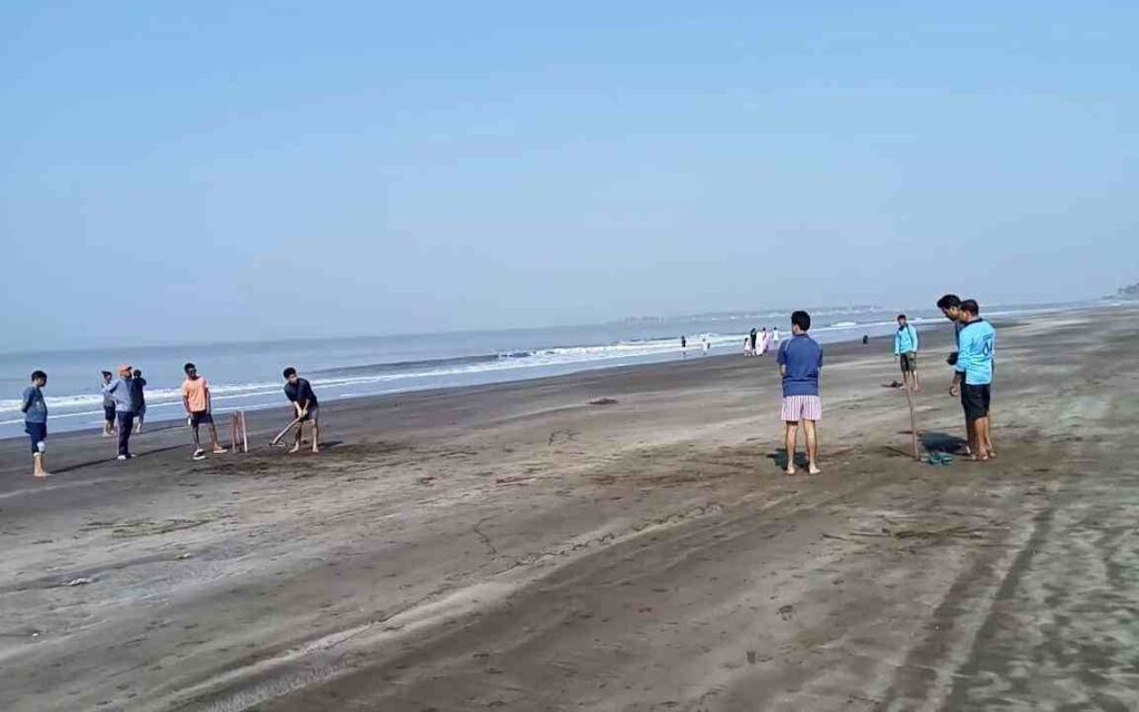 group of boys playing cricket at Navapur Beach vasai virar